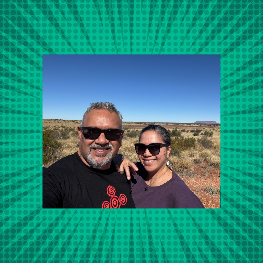 Mark Yettica-Paulson and Maryann Talia Pau, co-founders of Damper and Fetū Australian lifestyle blog, smiling together under the desert sun in Yulara, Northern Territory, celebrating culture, connection, and authentic living.