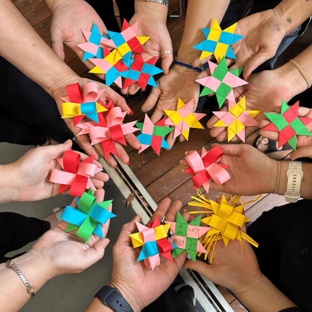 Star weavers holding their stars for a colleague who passed away. Weaving healing and peace for each other.