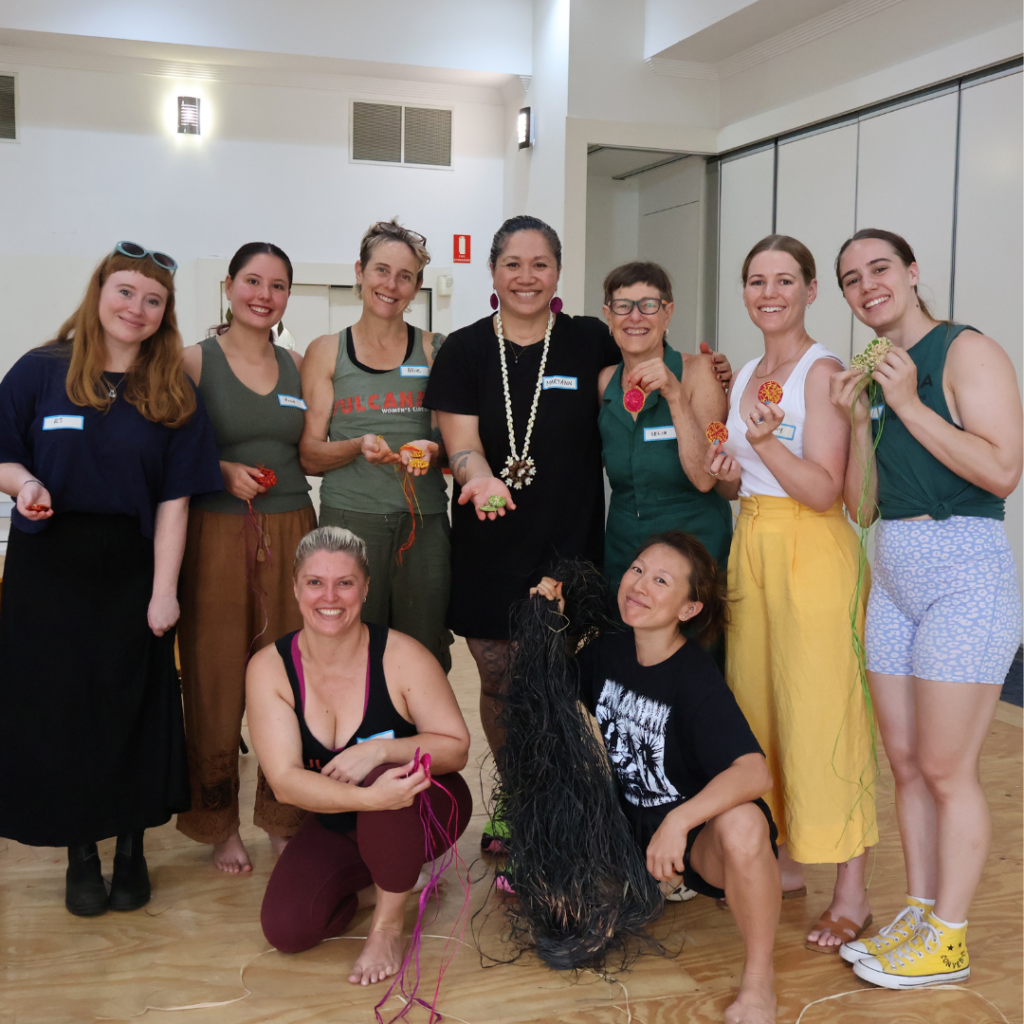 Weaving workshop of women standing proud and smiling with their woven earrings at Vulcana Circus Studio Morningside Brisbane